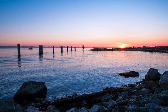 A Sunset View Of The Fraser River Meets The Georgia Straight At Garry Point Park In Steveston, British Columbia.