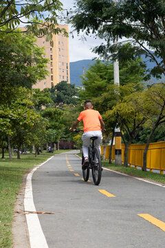 Hispanic Latino Teen Riding Bicycle