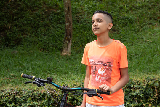 Latino hispanic teen on a mountain bike