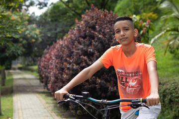 latin boy on a mountain bike