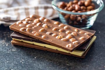 Various chocolate bars with hazelnuts.