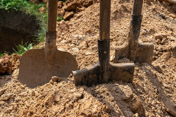 Shovels in the ground. Earthwork construction concept.