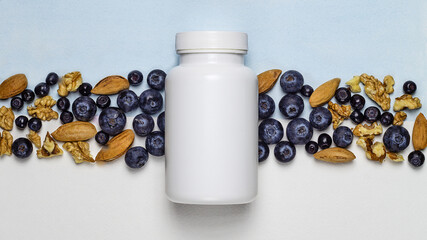 White plastic jar with dietary supplements or vitamines