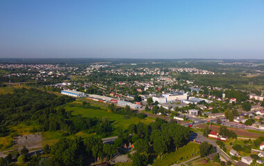Fototapeta na wymiar Aerial view of a small green city on a summer day