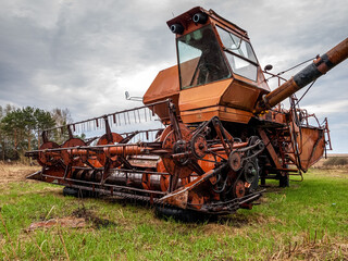 Fototapeta premium Field harvester for the assembly of grain crops, cutting, threshing of wheat and rye, farming