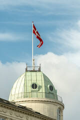 Denmark flag with blue sky. Copenhague, Denmark. 