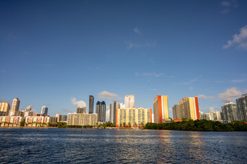 Sunny Isles Beach with bay water in foreground