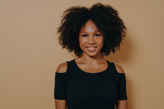 Portrait Of Cheerful Smiling Beautiful Dark-skinned Girl In Black Tshirt