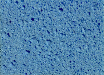 Fototapeta na wymiar blue sponge with holes texture background