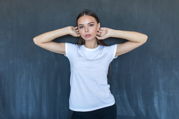 Attractive young woman in white blank t-shirt.