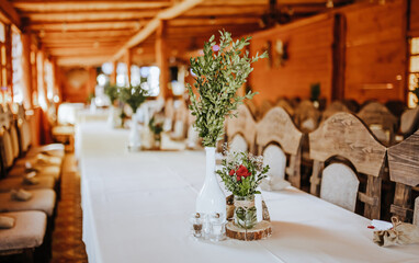 Wedding banquet decoration. Place for the guests decorated with flowers and plants at the party