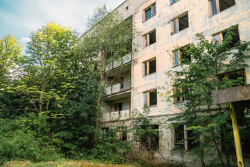 Fototapeta na wymiar Decaying residential apartment blocks in Pripyat, Ukraine in the Chernobyl Exclusion Zone