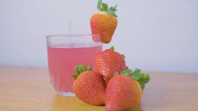 making a strawberry drink for summer