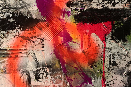 Abstract graffiti style background featuring red spray paint on black and white.