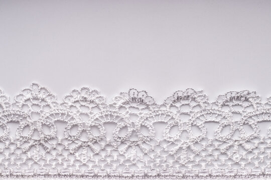 White lace on a white background.