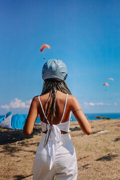 Woman skydriver with protective helmet in white clothing