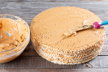 Step by step, making a waffle cake, with condensed milk, cocoa and butter.