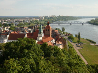 Obraz premium St. Nicolas' Church, City Townhall and Vistula river viewed from the top of Klimek lookout tower, Grudziądz, Poland