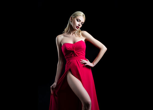 Fashion art studio portrait of beautiful elegant woman in red.