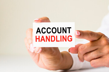 phrase ACCOUNT HANDLING written on a white paper card