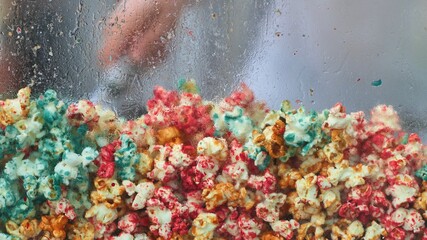 colored popcorn on white background