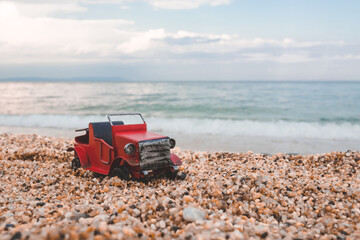 Fototapeta na wymiar Vintage miniature old car on summer background.