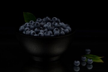Blueberries on black background, low key blueberry fruits.