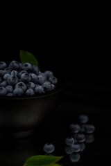 Blueberries on black background, low key blueberry fruits.