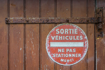 no parking sign on a french garage