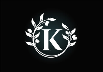 Initial letter K sign symbol with olive branch wreath. Round floral frame made by the olive branch. Agriculture industry logo design vector template. Olive oil label