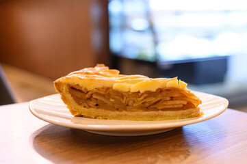 Closeup of a slice of cinnamon apple pie on a plate