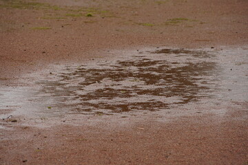 Wet terrain after a long rain on the ground with pavement