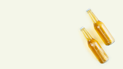 A two bottles of craft beer on light beige background. International beer day or Octoberfest concepts.Resting and Drinking beer after a hard working day in the home.Minimalistic photo.Copy space.
