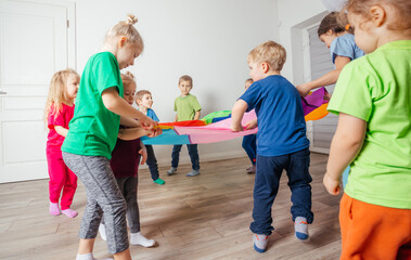 Dynamic and team building games for kids with colorful canopy