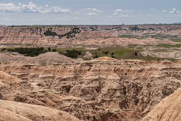 Badlands National Park, SD, USA - June 1, 2008: Closeup of canyon wall of beige-brown geological...