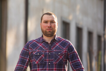 Portrait of middle-aged man with a beard in a shirt