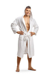 Full length portrait of a young fit man wearing a white bathrobe