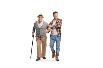 Young man helping an old man with a walking cane