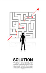 Silhouette of Businessman standing with plan to exit from maze . Business concept for problem solving and solution strategy