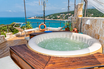 Hot Tub at a Luxury Resort. Outdoor hot tub and sea view © nedomacki