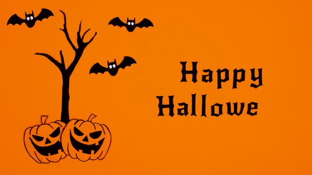 Flaying bats with Happy Halloween text and pumpkins and creepy tree. Stop motion