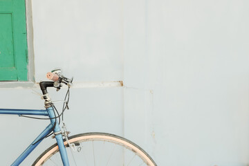 blue bicycle on minimalist white background