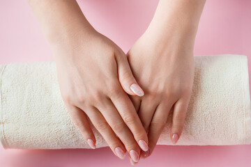 Spa procedure for nail care in a beauty salon. Female hands and tools for manicure on pink...