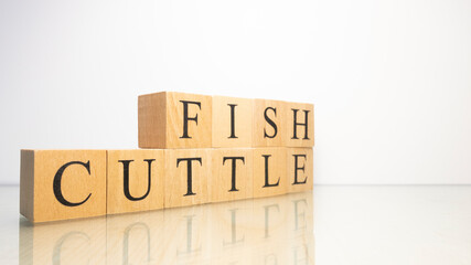 The name Cuttlefish was created from wooden letter cubes. Seafood and food.