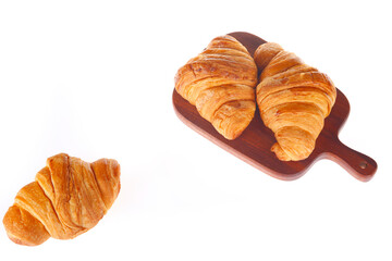 Crisp fresh croissants in the background