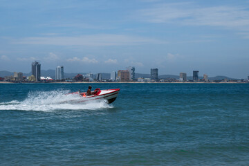 Man riding a speed boat in the sea selective focus