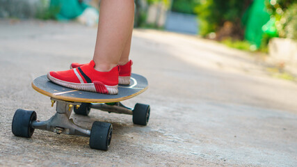 kid on surfskate or Skateboard ready for riding at outdoor on the road
