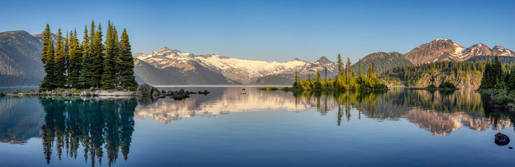 Panoramic View of Canadian Nature Landscape with rocky islands and mountains in the background. Garibaldi Lake, Near Whistler and Squamish, North of Vancouver, British Columbia, Canada. Summer Sunset