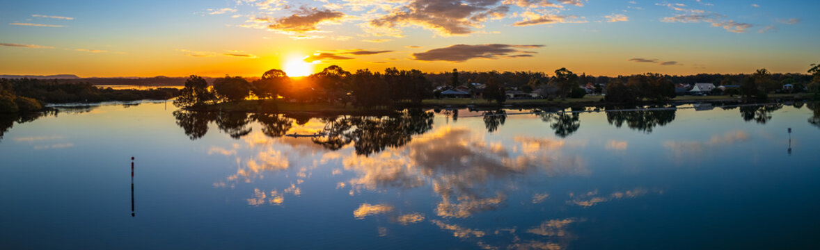 Sunset Panorama with Clouds and Reflections in the Bay