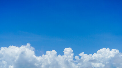Naklejka na ściany i meble Beautiful blue sky and big white clouds in the summer sky